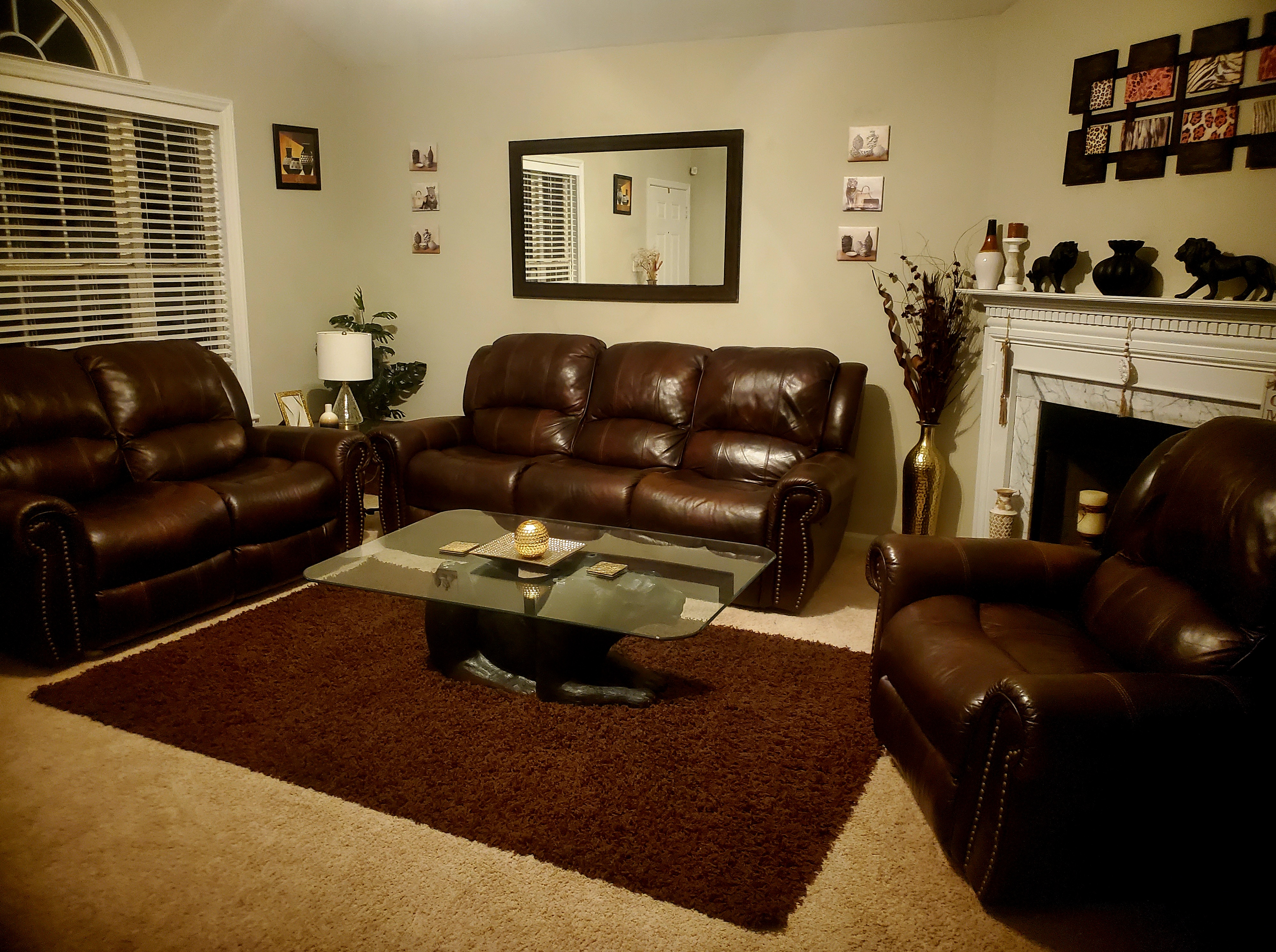 Warm living room interior design with leather seating and neutral palette
